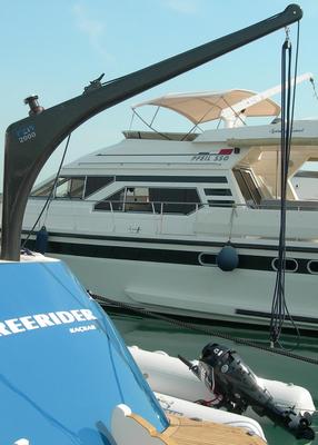 Carbon davit installed on a yacht to lift a rib